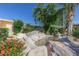 Relaxing courtyard with pond, fountain, and colorful flowers at 2460 E Main St # A17, Mesa, AZ 85213
