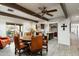 Open concept dining room with view into kitchen and access to patio at 39839 N Spur Cross Rd, Cave Creek, AZ 85331