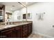 Double vanity bathroom with granite countertop and dark wood cabinets at 39839 N Spur Cross Rd, Cave Creek, AZ 85331