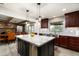Modern kitchen with granite island and stainless steel appliances at 39839 N Spur Cross Rd, Cave Creek, AZ 85331