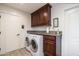 Laundry room with washer, dryer, and granite countertop at 39839 N Spur Cross Rd, Cave Creek, AZ 85331