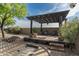 Peaceful pergola with seating area and a horseshoe pit at 39839 N Spur Cross Rd, Cave Creek, AZ 85331