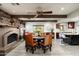 Spacious dining area with rustic table and fireplace at 39839 N Spur Cross Rd, Cave Creek, AZ 85331
