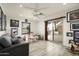 Playroom with grey sofa and sliding glass doors to patio at 39839 N Spur Cross Rd, Cave Creek, AZ 85331
