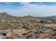 Aerial view showing desert landscape, roads, and a house with surrounding land at 39839 N Spur Cross Rd, Cave Creek, AZ 85331