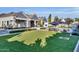 Large backyard with pool, patio, and artificial turf at 20445 E Sunset Ct, Queen Creek, AZ 85142