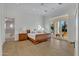 Main bedroom with hardwood floors and en-suite bathroom at 20445 E Sunset Ct, Queen Creek, AZ 85142