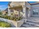 Elegant home entrance with a covered porch and stone steps at 20445 E Sunset Ct, Queen Creek, AZ 85142