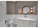 Elegant powder room with marble vanity and modern fixtures at 20445 E Sunset Ct, Queen Creek, AZ 85142