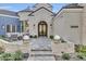 Elegant home entrance with a grand stone facade at 20445 E Sunset Ct, Queen Creek, AZ 85142