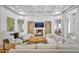 Grand living room features a fireplace, built-in shelving, and hardwood floors at 20445 E Sunset Ct, Queen Creek, AZ 85142