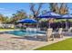 Inviting swimming pool with spacious patio and lounge chairs at 20445 E Sunset Ct, Queen Creek, AZ 85142