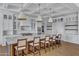 Gourmet kitchen boasts a large island, white cabinetry, and high-end appliances at 20445 E Sunset Ct, Queen Creek, AZ 85142