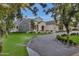 Elegant home with stone accents and a welcoming front entrance at 20445 E Sunset Ct, Queen Creek, AZ 85142