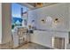 Outdoor kitchen with stainless steel appliances and white tile at 20445 E Sunset Ct, Queen Creek, AZ 85142