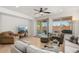 Bright living room, access to backyard, and comfortable furniture at 20712 N 273Rd Ave, Buckeye, AZ 85396