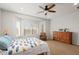 Bright bedroom with bay window and ceiling fan at 20712 N 273Rd Ave, Buckeye, AZ 85396