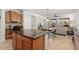 Open kitchen with island and view into living room at 20712 N 273Rd Ave, Buckeye, AZ 85396