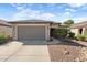 One-story home with gray garage door at 20712 N 273Rd Ave, Buckeye, AZ 85396