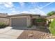 One-story home with gray garage door at 20712 N 273Rd Ave, Buckeye, AZ 85396