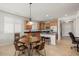 Bright kitchen with wood cabinets, granite counters, and island at 20712 N 273Rd Ave, Buckeye, AZ 85396