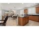 Open kitchen with island and stainless steel appliances at 20712 N 273Rd Ave, Buckeye, AZ 85396