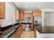 Kitchen with granite countertops and stainless steel appliances at 20712 N 273Rd Ave, Buckeye, AZ 85396