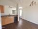 Bright kitchen featuring wood cabinets, dark flooring, and modern appliances at 368 W Phantom Dr, Casa Grande, AZ 85122