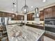 Modern kitchen with granite countertops and stainless steel appliances at 2072 E Blackhawk Ct, Gilbert, AZ 85298