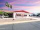 Single-wide manufactured home with carport and desert landscaping at 8103 E Southern Ave # 298, Mesa, AZ 85209