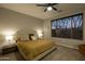 Relaxing main bedroom with large window and ensuite bathroom at 41448 N Bent Creek Way, Phoenix, AZ 85086