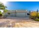 Two-car garage and attractive facade of this home at 6035 E Monterra Way, Scottsdale, AZ 85262