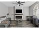 Living room with a modern fireplace and built-in shelving at 1675 E Bridgeport Pkwy, Gilbert, AZ 85295