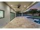 Spacious covered patio with ceiling fan, and access to pool and backyard at 5919 N 45Th St, Phoenix, AZ 85018