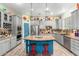 Modern kitchen with gray cabinets and a blue island at 20475 E Palomino Dr, Queen Creek, AZ 85142