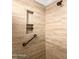 Walk-in shower with built-in shelving and grab bar at 20475 E Palomino Dr, Queen Creek, AZ 85142