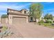 Beautiful two-story home with a large driveway and landscaped yard at 3424 E Plum St, Gilbert, AZ 85298