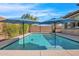 Inviting swimming pool with two umbrellas and a spacious patio at 3424 E Plum St, Gilbert, AZ 85298