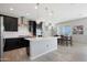 Modern kitchen with white countertops and dark cabinetry at 19625 W Pinchot Dr, Buckeye, AZ 85396