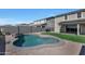 Freeform pool with a waterfall feature in the backyard at 19625 W Pinchot Dr, Buckeye, AZ 85396