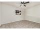 Bright bedroom with ceiling fan and tile flooring at 3816 W Thomas Rd, Phoenix, AZ 85019