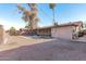 View of home's back and covered patio, plus a yard at 3816 W Thomas Rd, Phoenix, AZ 85019