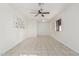 Charming bedroom with tile flooring and ceiling fan at 3816 W Thomas Rd, Phoenix, AZ 85019