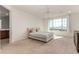 Main bedroom with large window and ensuite bathroom at 23095 E Mewes Rd, Queen Creek, AZ 85142