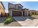 Two-story home with stone accents and a two-car garage at 23095 E Mewes Rd, Queen Creek, AZ 85142