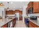 Modern kitchen with stainless steel appliances and granite countertops at 23095 E Mewes Rd, Queen Creek, AZ 85142