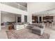Spacious living room with high ceilings and a large sectional sofa at 23095 E Mewes Rd, Queen Creek, AZ 85142