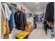 Large walk-in closet with ample shelving and hanging space at 23095 E Mewes Rd, Queen Creek, AZ 85142