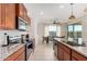 Modern kitchen with stainless steel appliances and granite countertops at 23095 E Mewes Rd, Queen Creek, AZ 85142