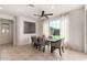 Dining area with a table and chairs, looking out to the backyard at 23095 E Mewes Rd, Queen Creek, AZ 85142